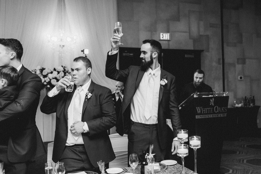 Couple Toasting Glasses at White Oaks Wedding Reception