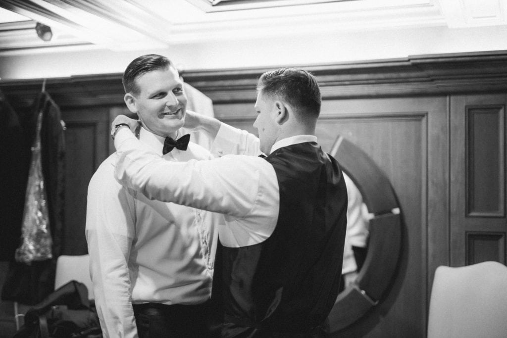 Black & White Photo of Groom Getting Ready for his wedding at Pillar & Post