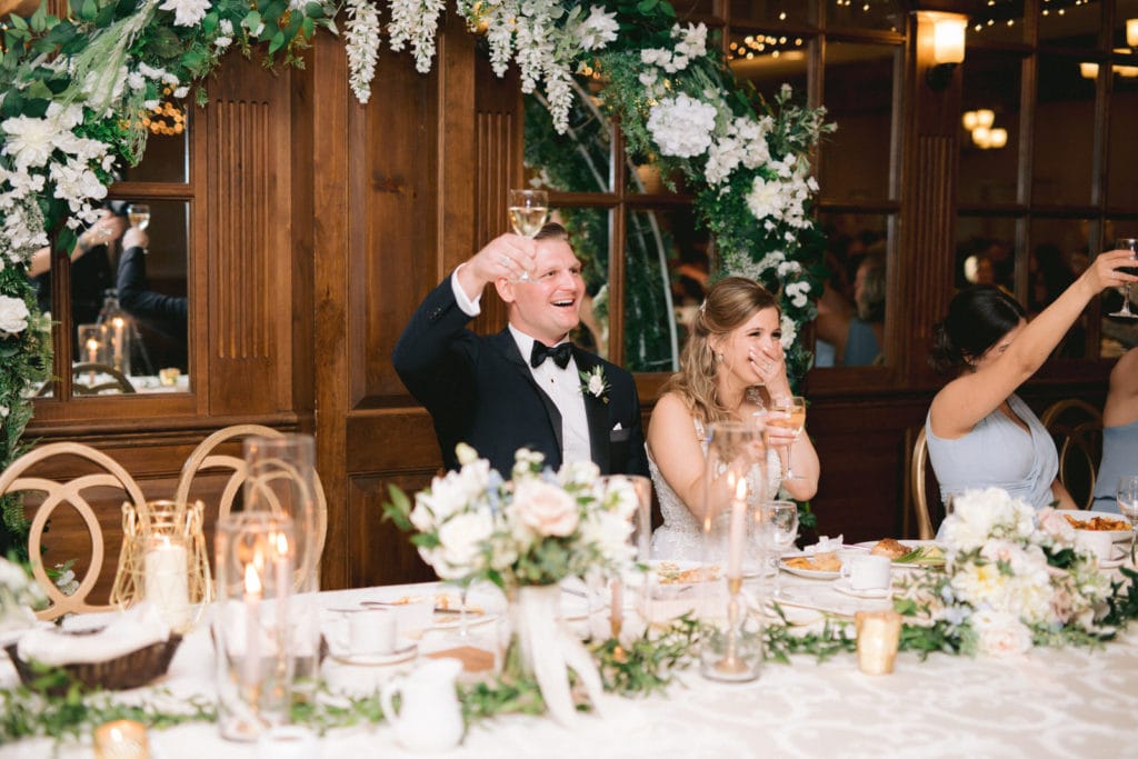 Bride & Groom Laughing at wedding speech