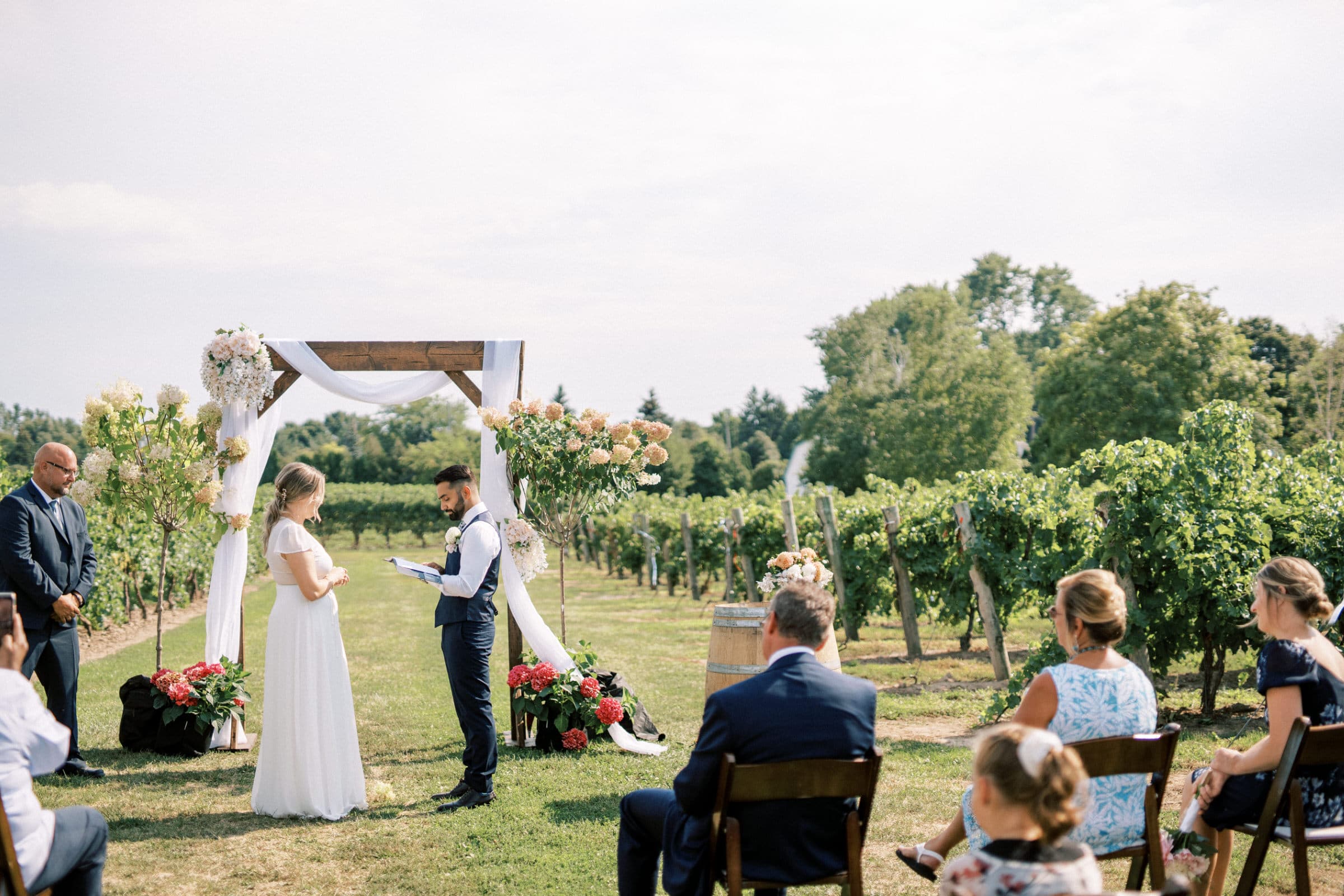 Bride & Groom Reading Vows at Intimate Wedding in Niagara on the Lake